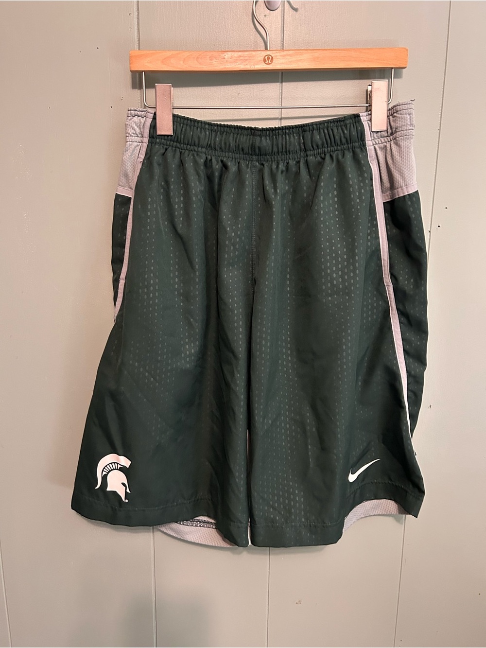Nike Men's Dark Green Athletic Shorts with White Trim and Spartan Logo